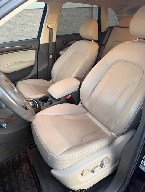 Interior view of Audi showing cream-colored leather seats with black trim